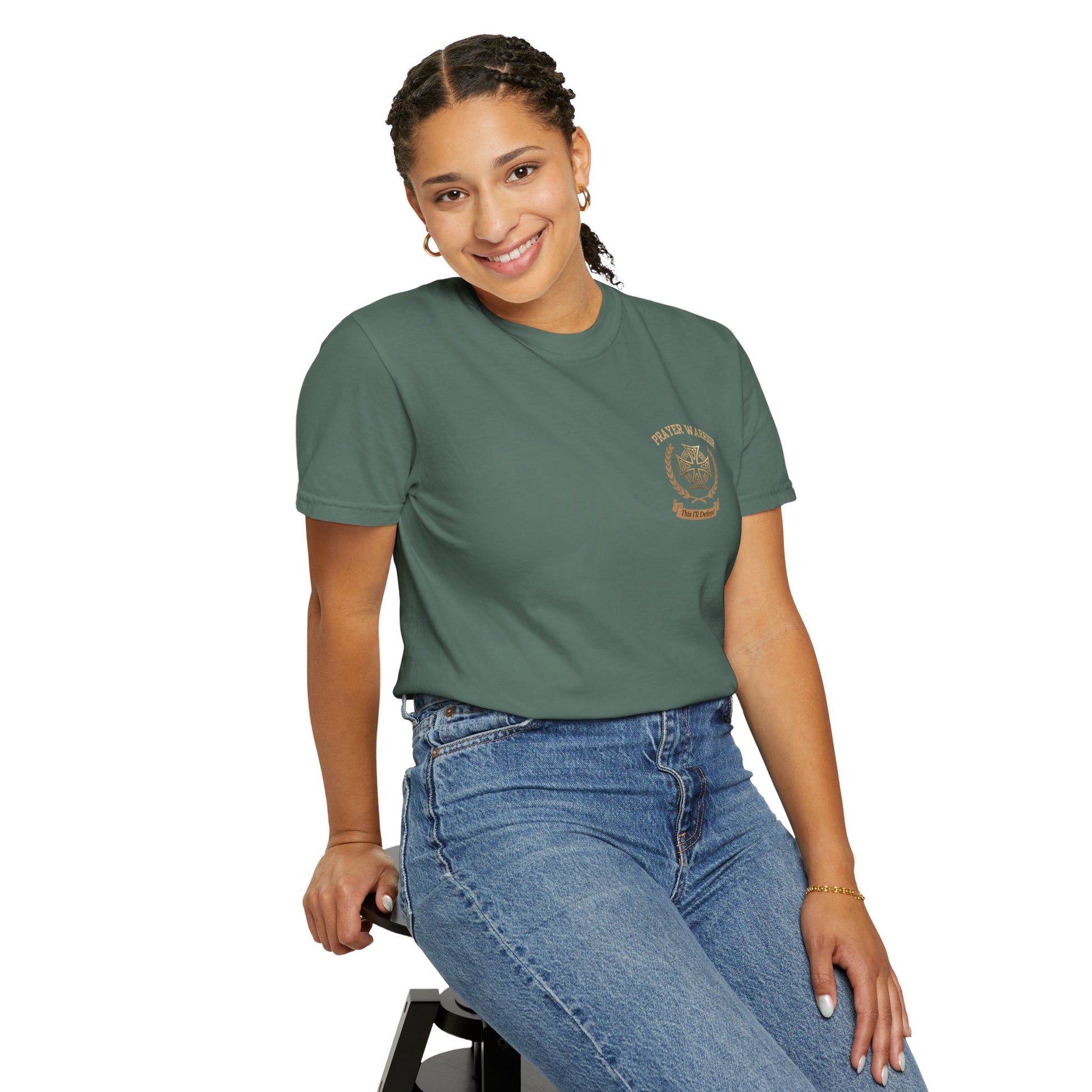 A woman wearing Prayer Warrior faith tee in Blue Spruce - front view showing PRAYER WARRIOR with Celtic cross crest on chest